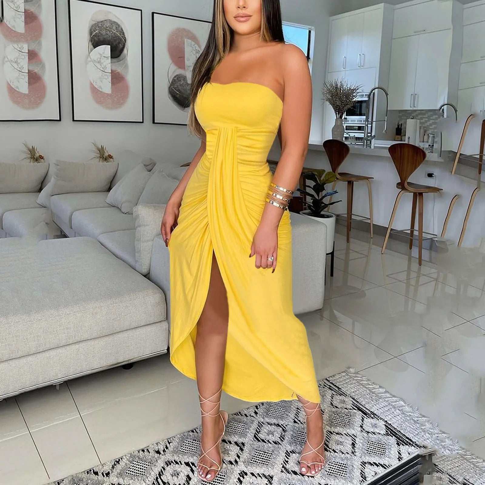 Yellow strapless shoulder dress with front slit, perfect for summer parties.