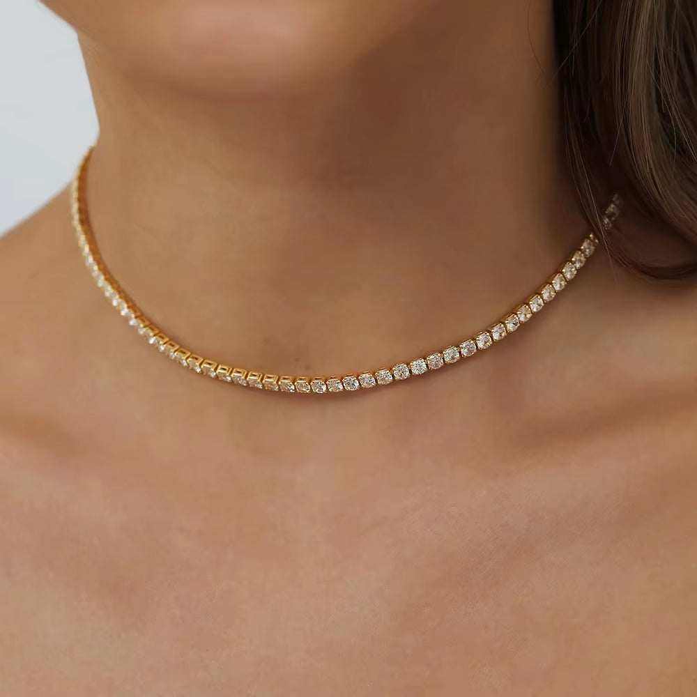 S925 silver plated 18K gold tennis necklace with 2mm moissanite stones on a woman's neck.