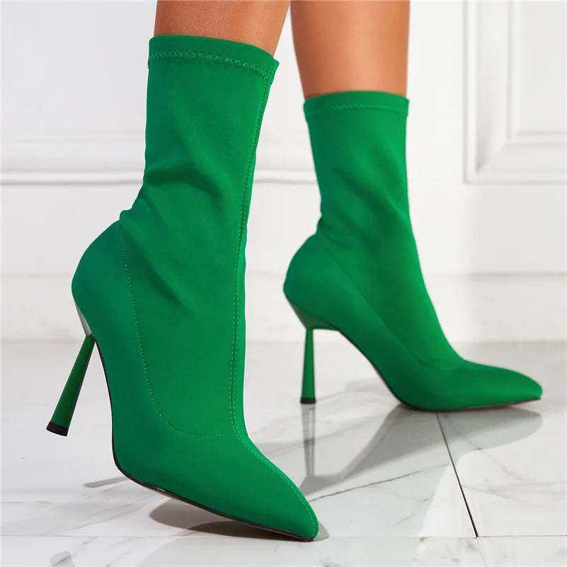 Green ankle boots with 11.5cm high heels and sleek stretch design.