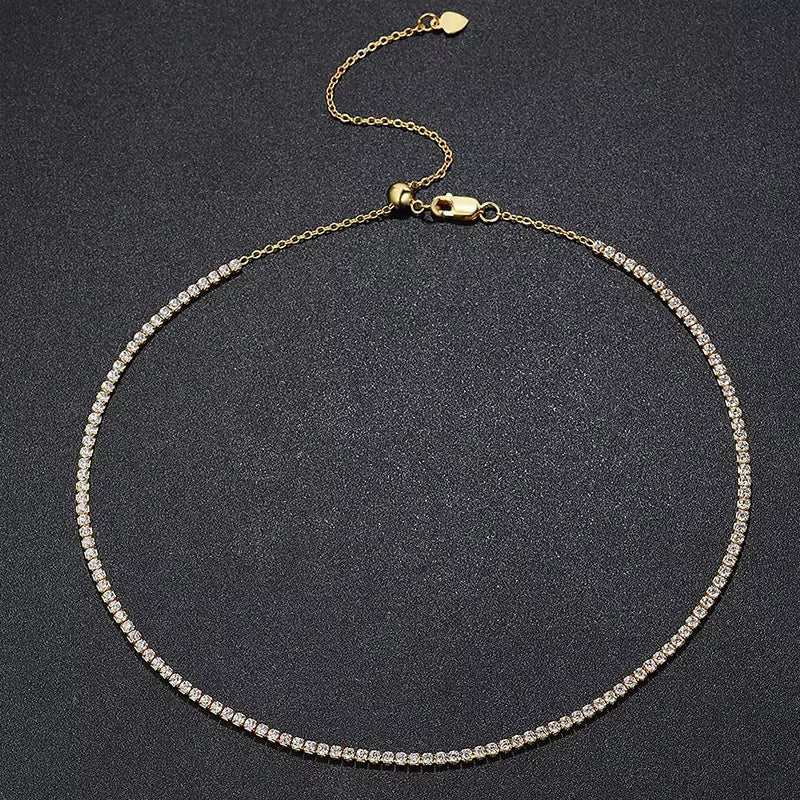 Tennis necklace with S925 silver plated 18K gold and sparkling rhinestones on a black background.