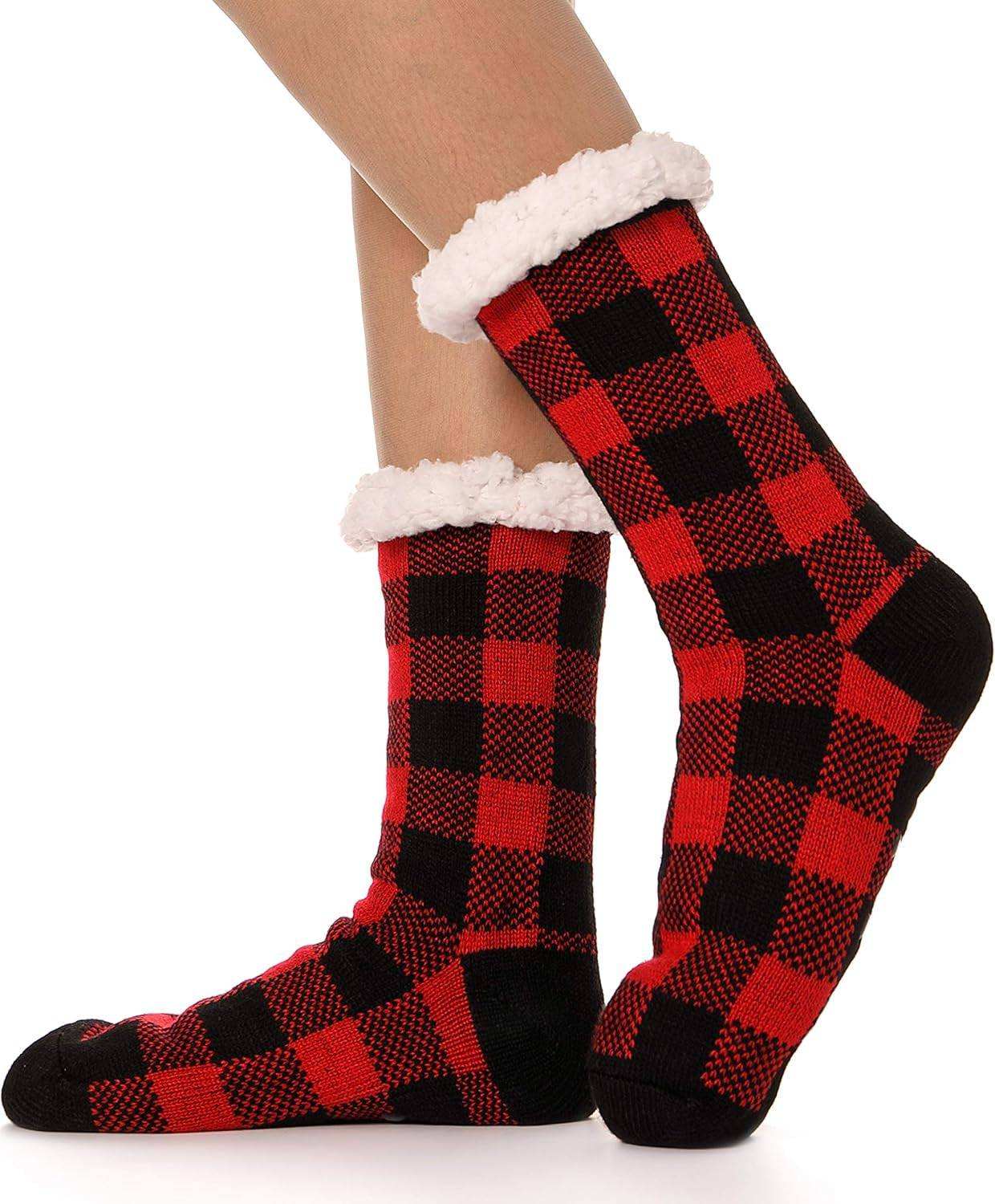 Red and black plaid slipper socks with fluffy white fleece lining and anti-slip grips.