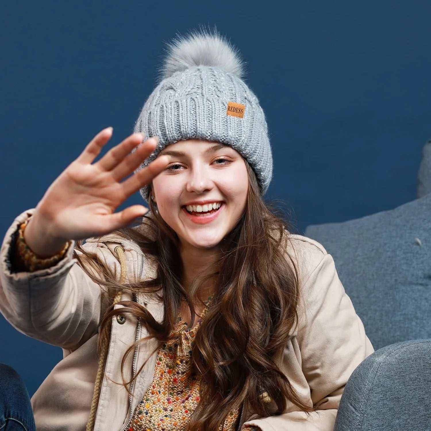 Pink women winter hat with fleece lining and pompom, offering warmth and style.