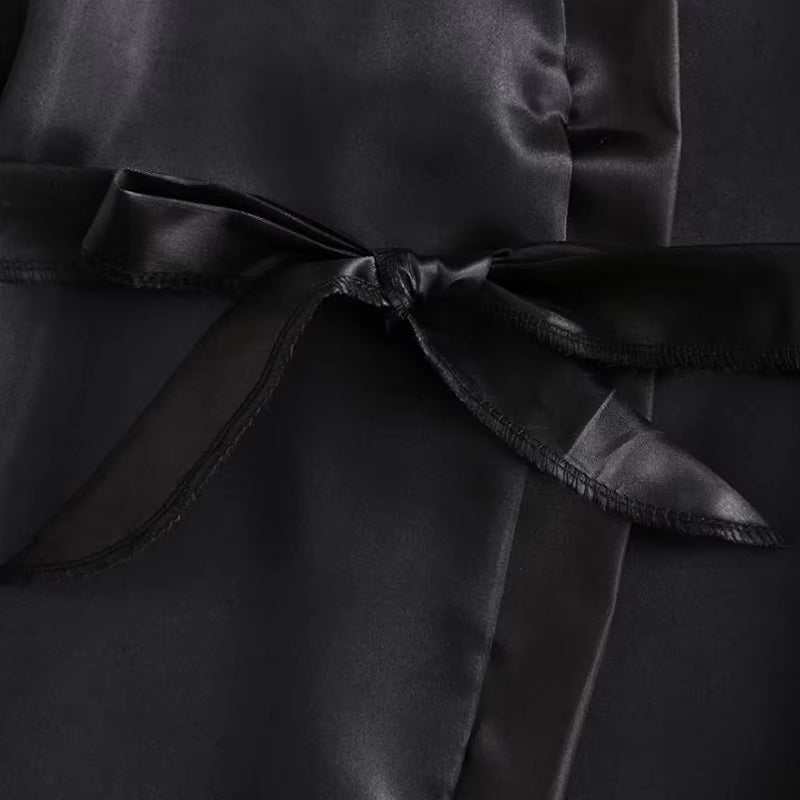 Black satin robe with bow detail from a 4-piece sexy underwear set.