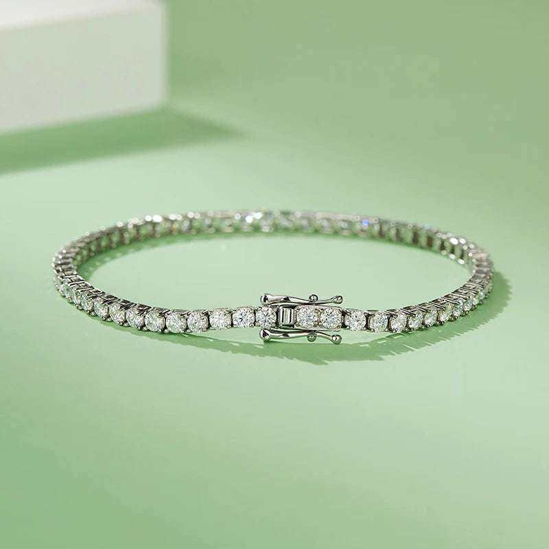 Custom Moissanite Diamond Tennis Bracelet Chains in 925 Silver on green background.
