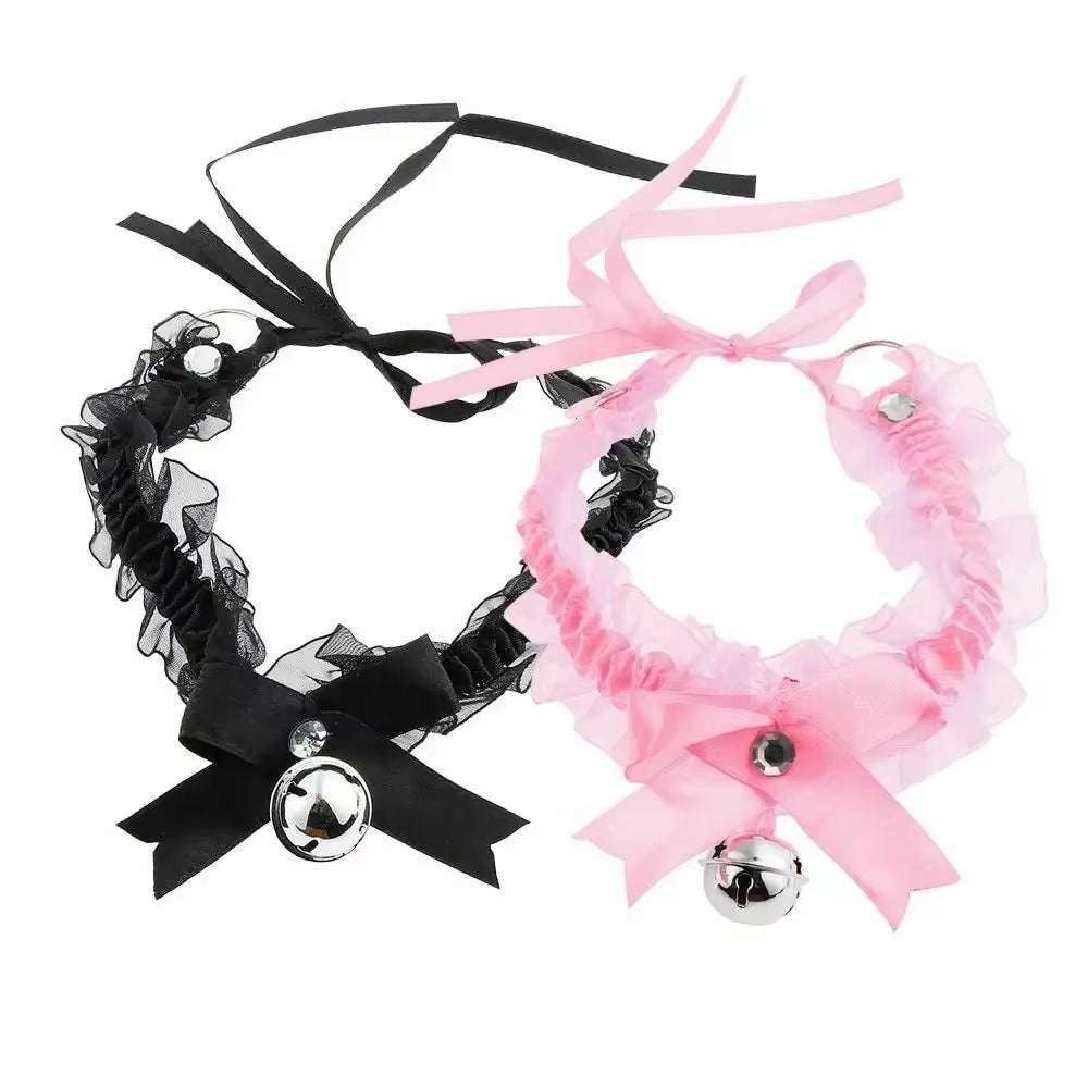 Black and pink lace bow choker necklaces with bell pendants.