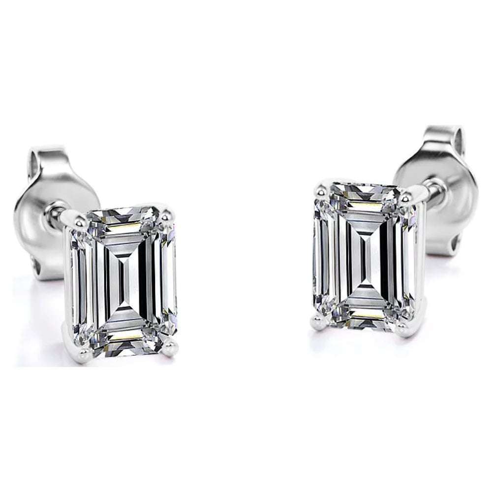 Ring Earrings and Pendant Emerald cut moissanite ring earrings and pendant set in white gold.