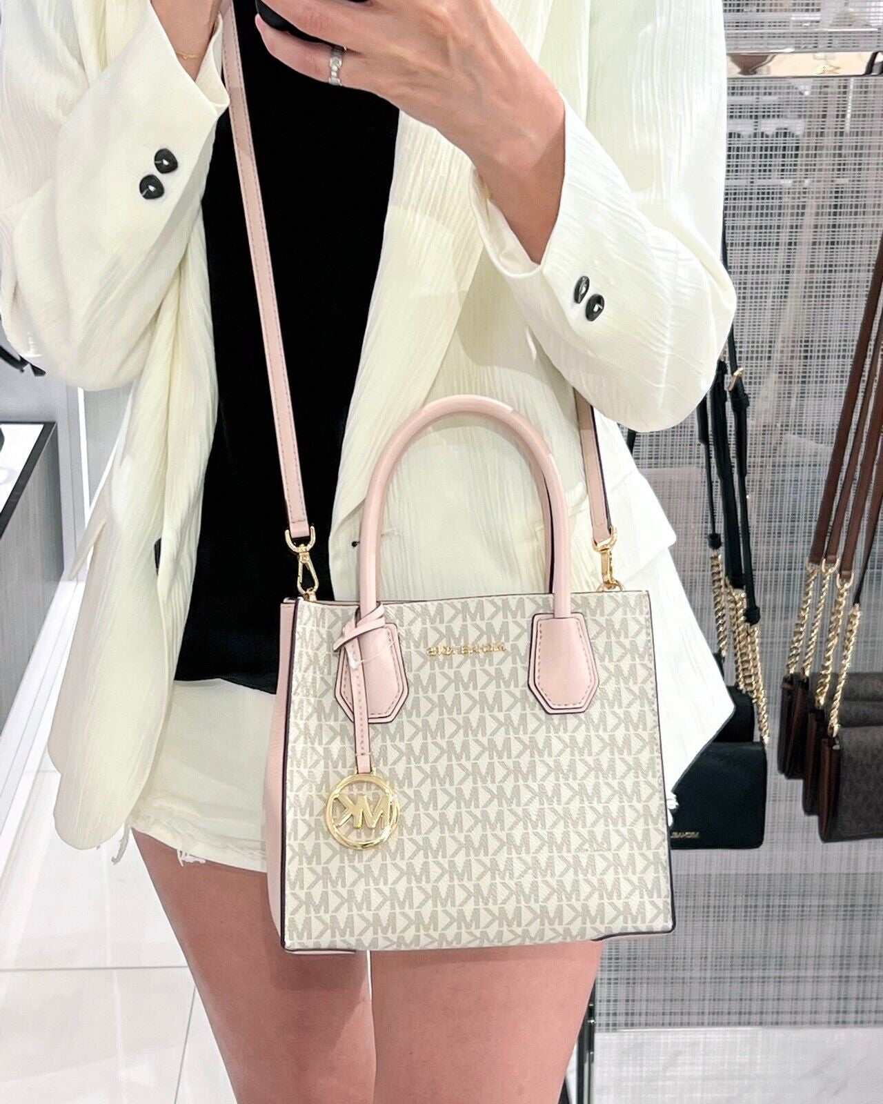 Michael Kors Mercer Messenger Medium Crossbody Bag in Vanilla Powder Blush, elegant design with gold-tone hardware.