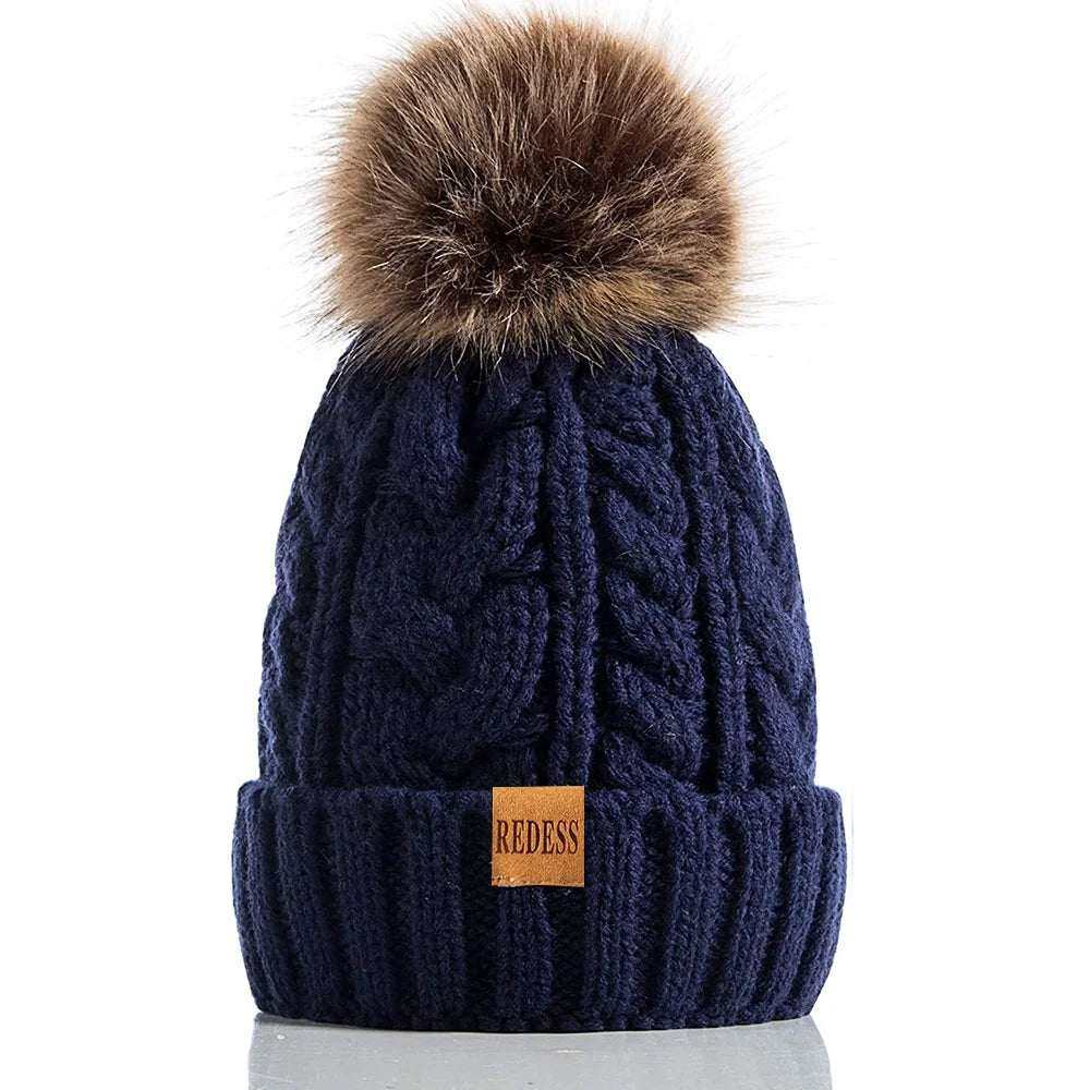 Women Winter Hat with fleece lining and pompom, in cute pink, for warmth and style.