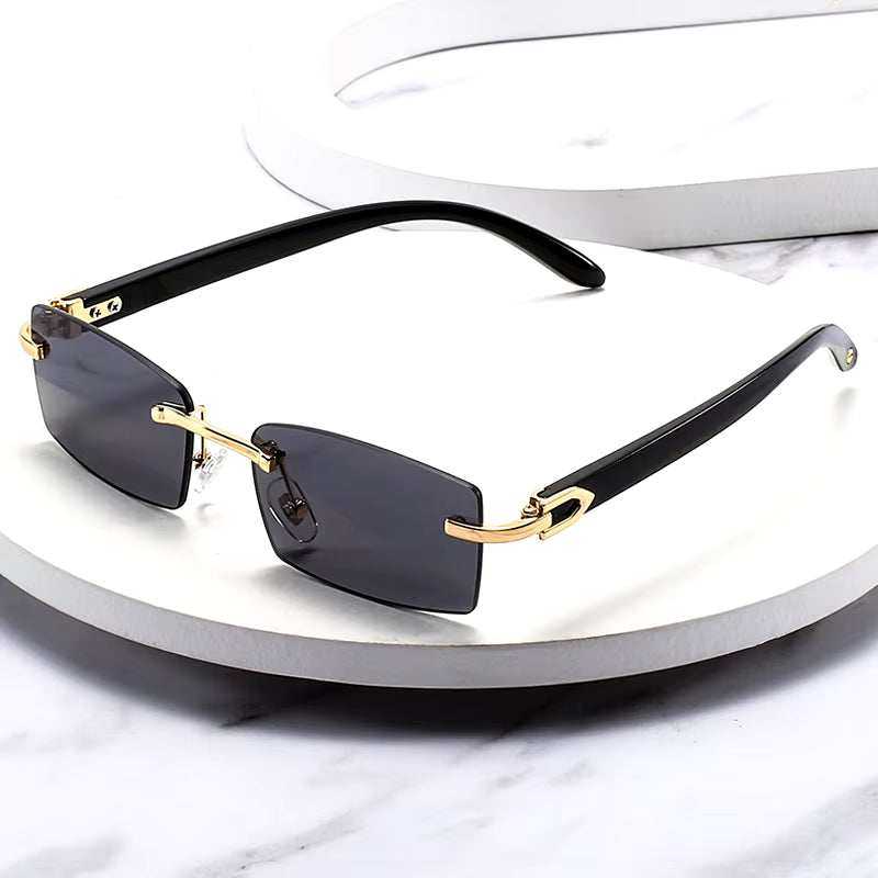 Sunglasses Rimless Rimless horn sunglasses with black lenses and gold detailing