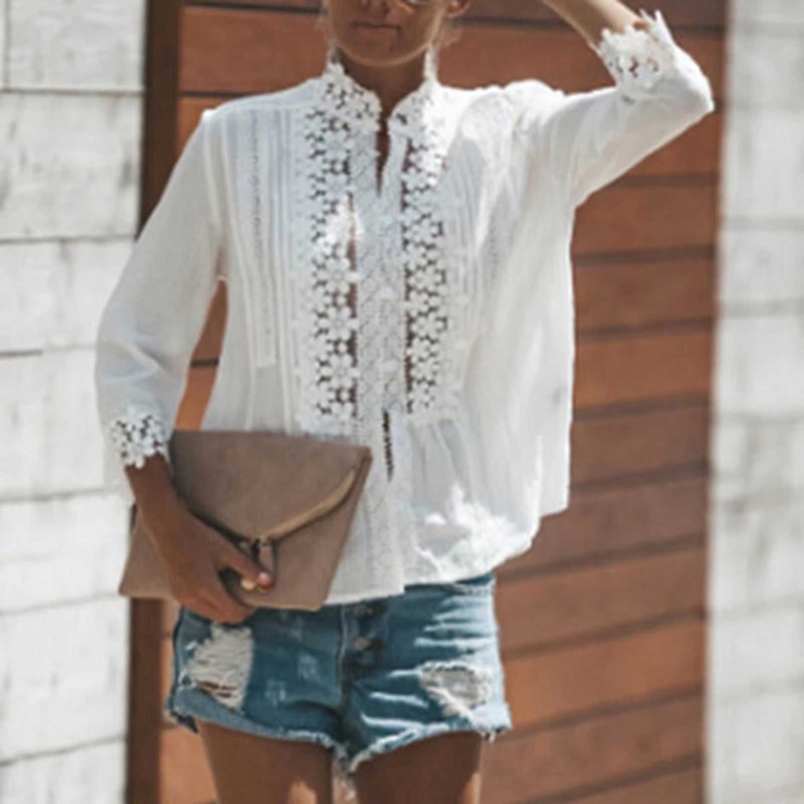 Women's fashion casual top with lace details, V-neck style, paired with denim shorts.