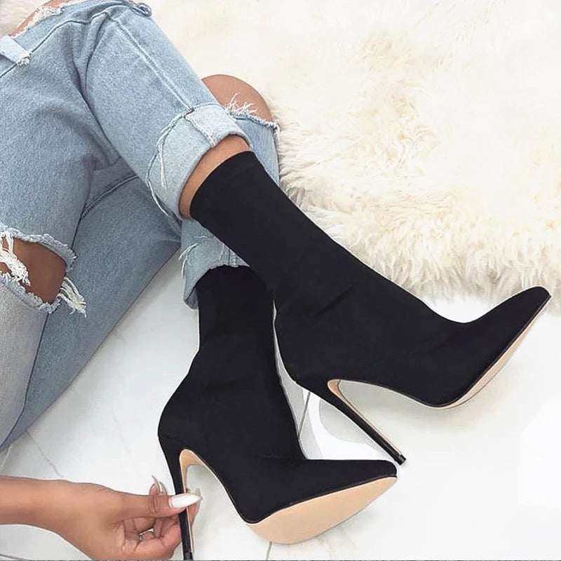 Black ankle boots with 11.5 cm high heels, featuring a sleek stretch design perfect for adding style to any outfit.