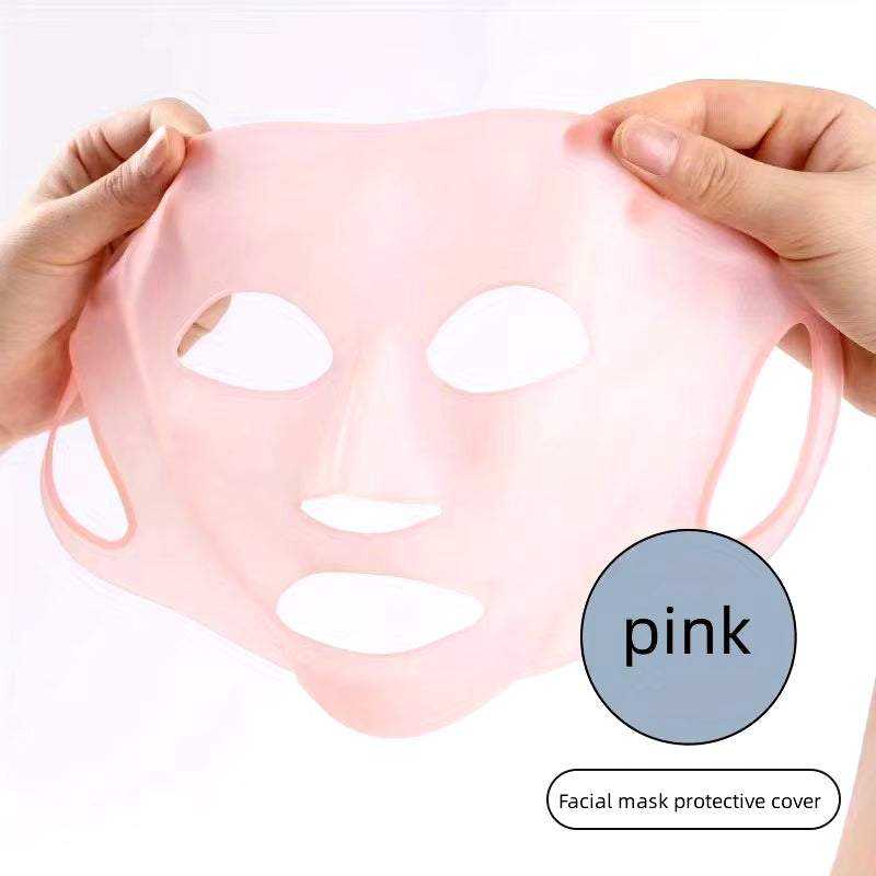 Pink 3D silicone face cover with ear loops, reusable moisturizing facial tool.