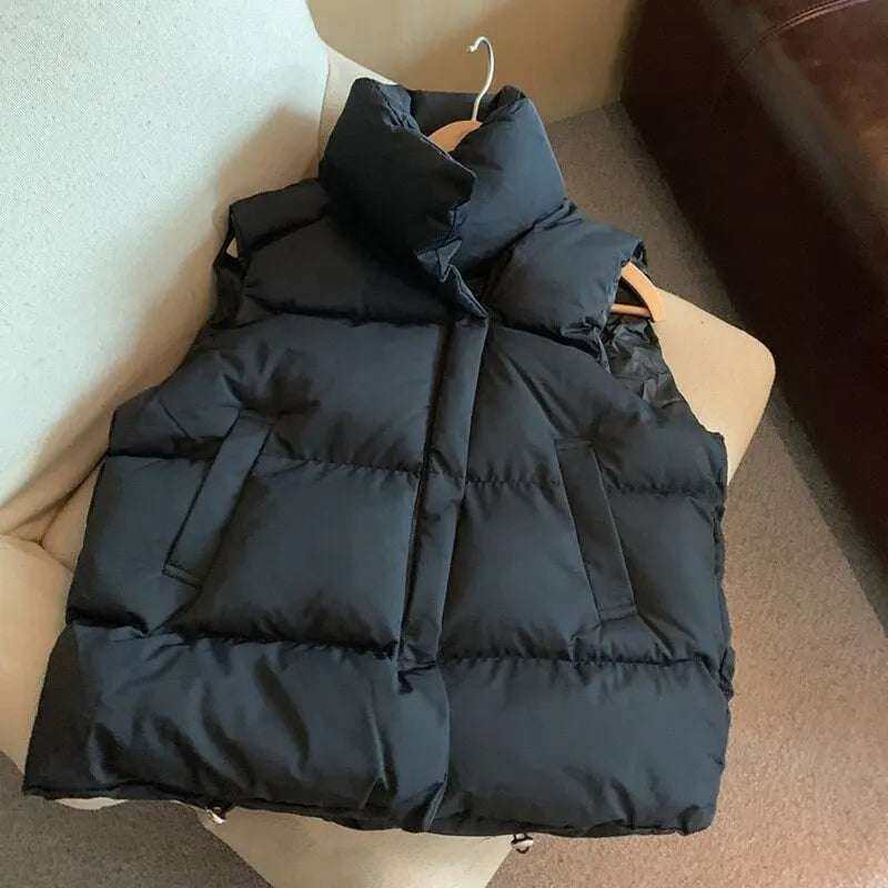 Thick winter vest coat for women, black, windproof, casual outerwear with stand collar.