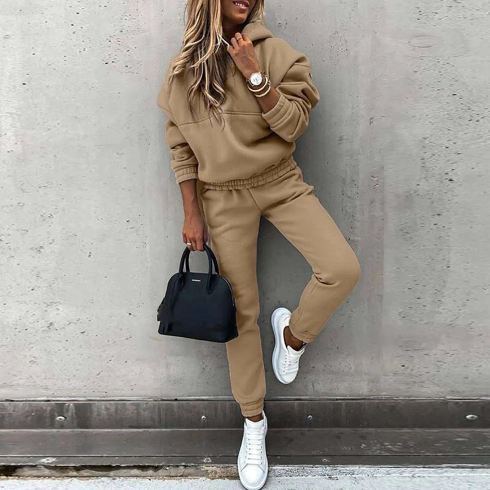 Women's hooded sweatshirt and trouser suit in beige, featuring a casual sport style for versatile comfort.