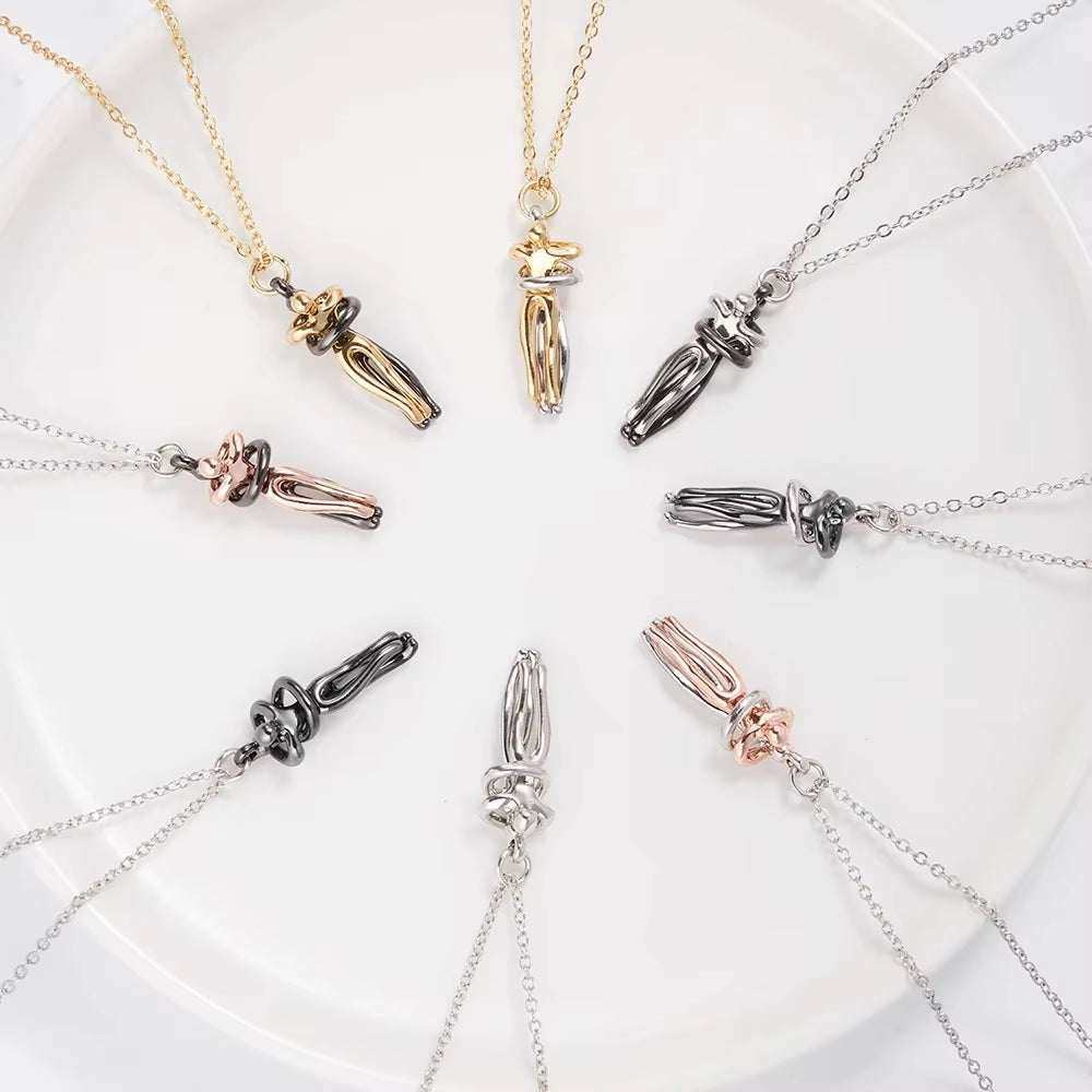 Fashion hugging necklace choker pendants in various metal finishes arranged in a circle on a white surface.