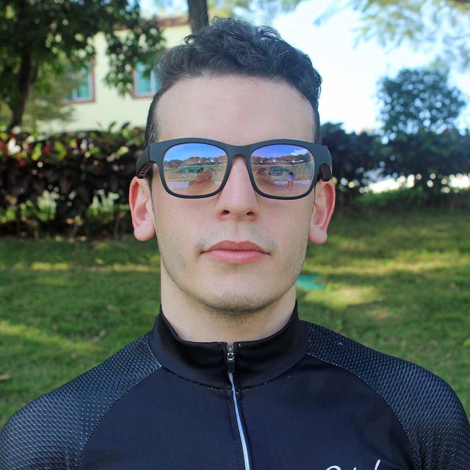 Smart audio Bluetooth sunglasses with polarized lenses in an outdoor setting.