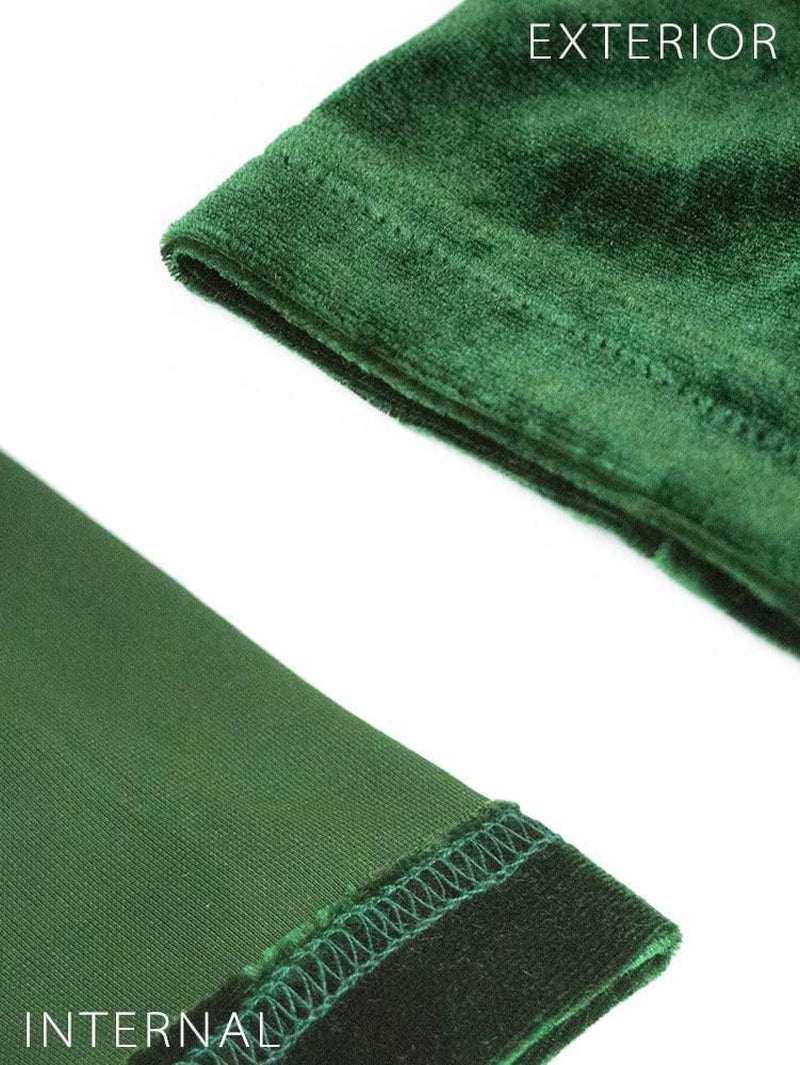 Close-up of green velvet fabric showing exterior and internal details.