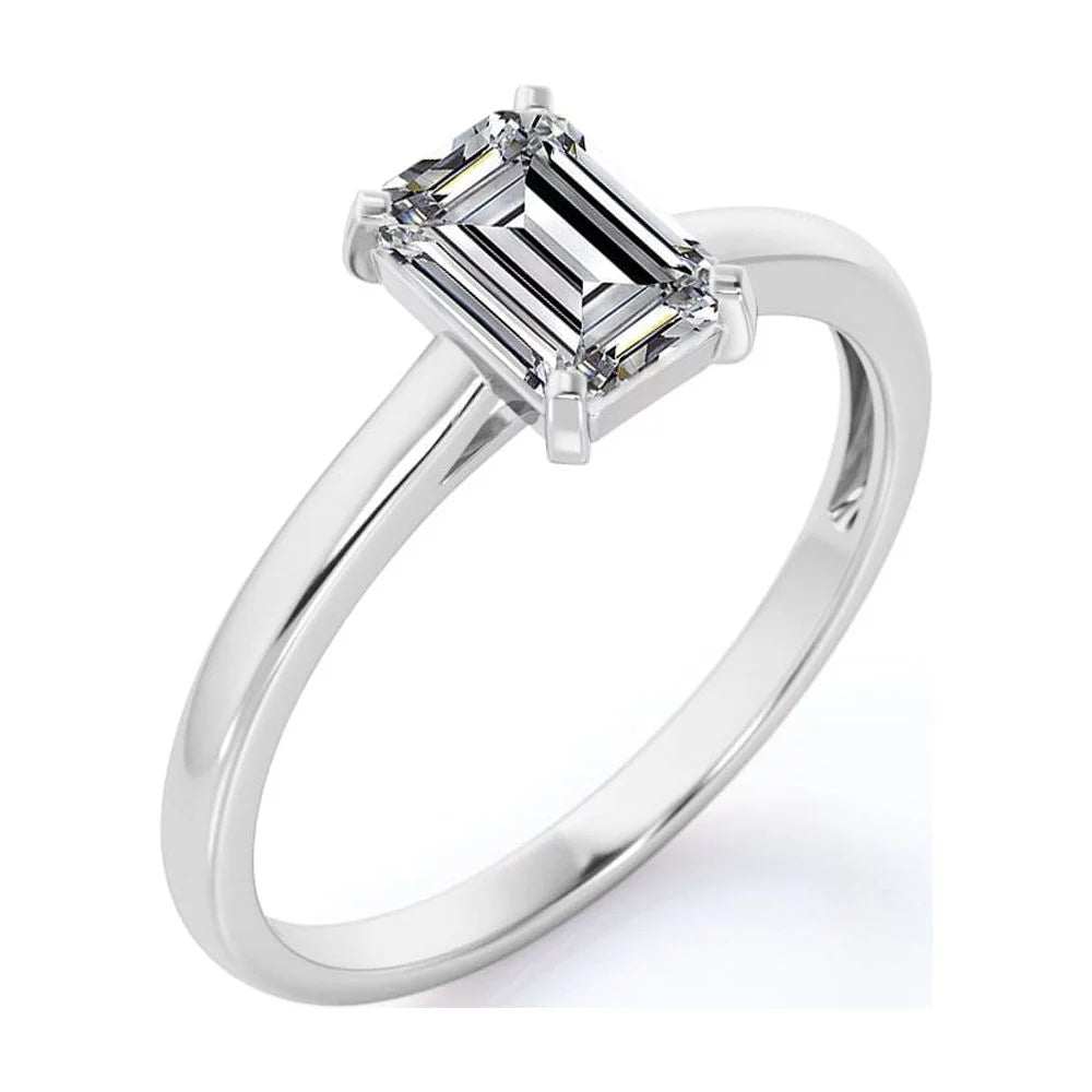 Emeral Ring Earrings and Pendant Emerald cut moissanite ring earrings and pendant set in white gold.d-cut moissanite ring set in 18K white gold over sterling silver.