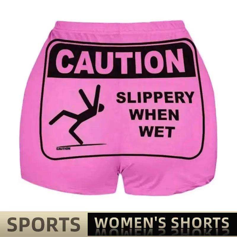 Pajamas boxer bottoms in soft pink with "Caution" sign design, sports style for women.