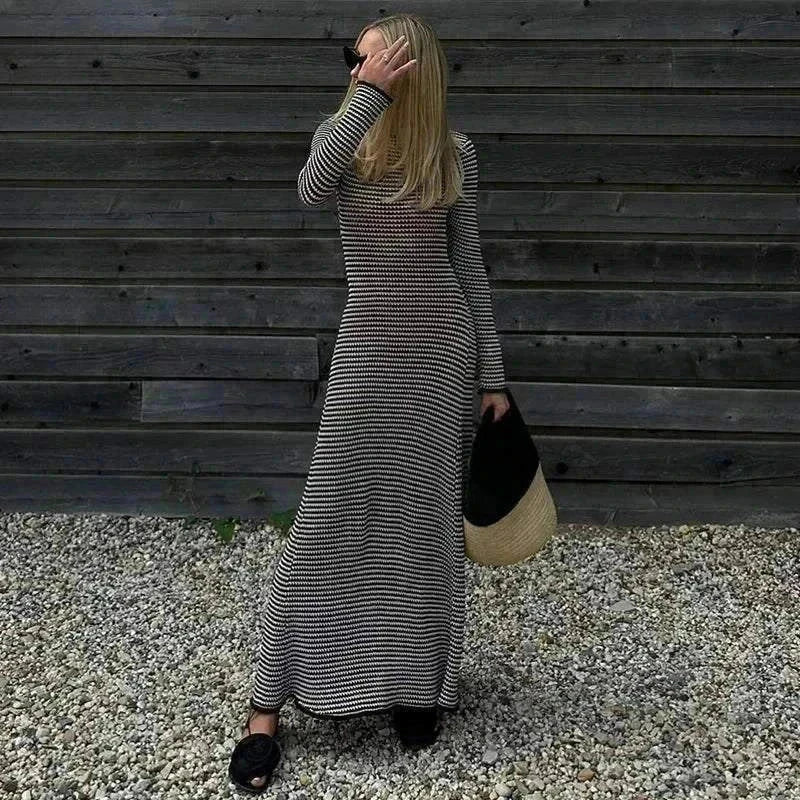 White striped maxi dress with long sleeves, perfect for autumn beachwear and holiday outings.