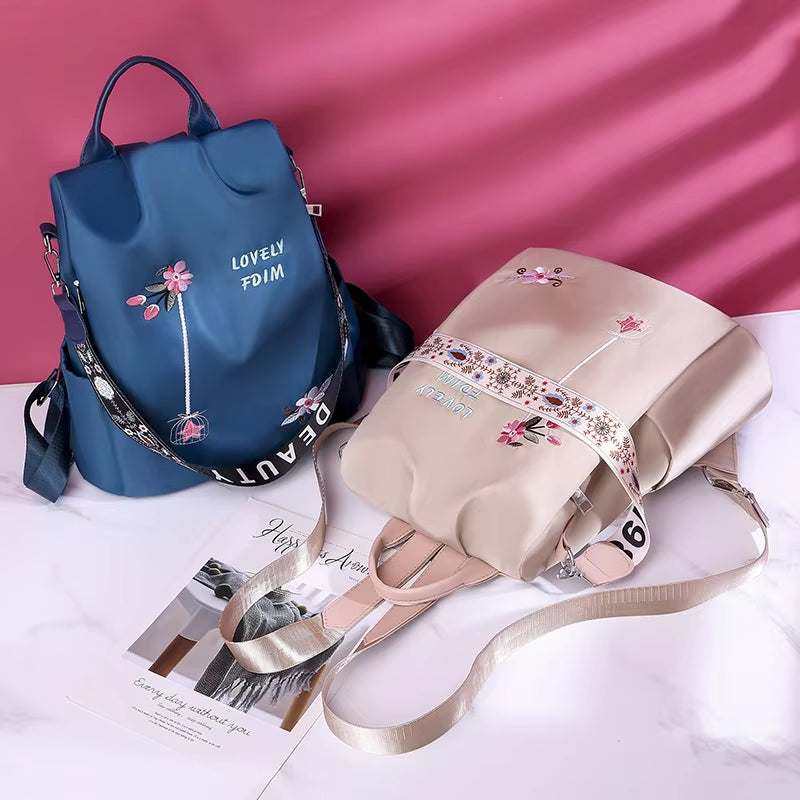 Fashionable women backpacks with embroidery detailing, featuring anti-theft design and waterproof canvas material, suitable for school and travel.