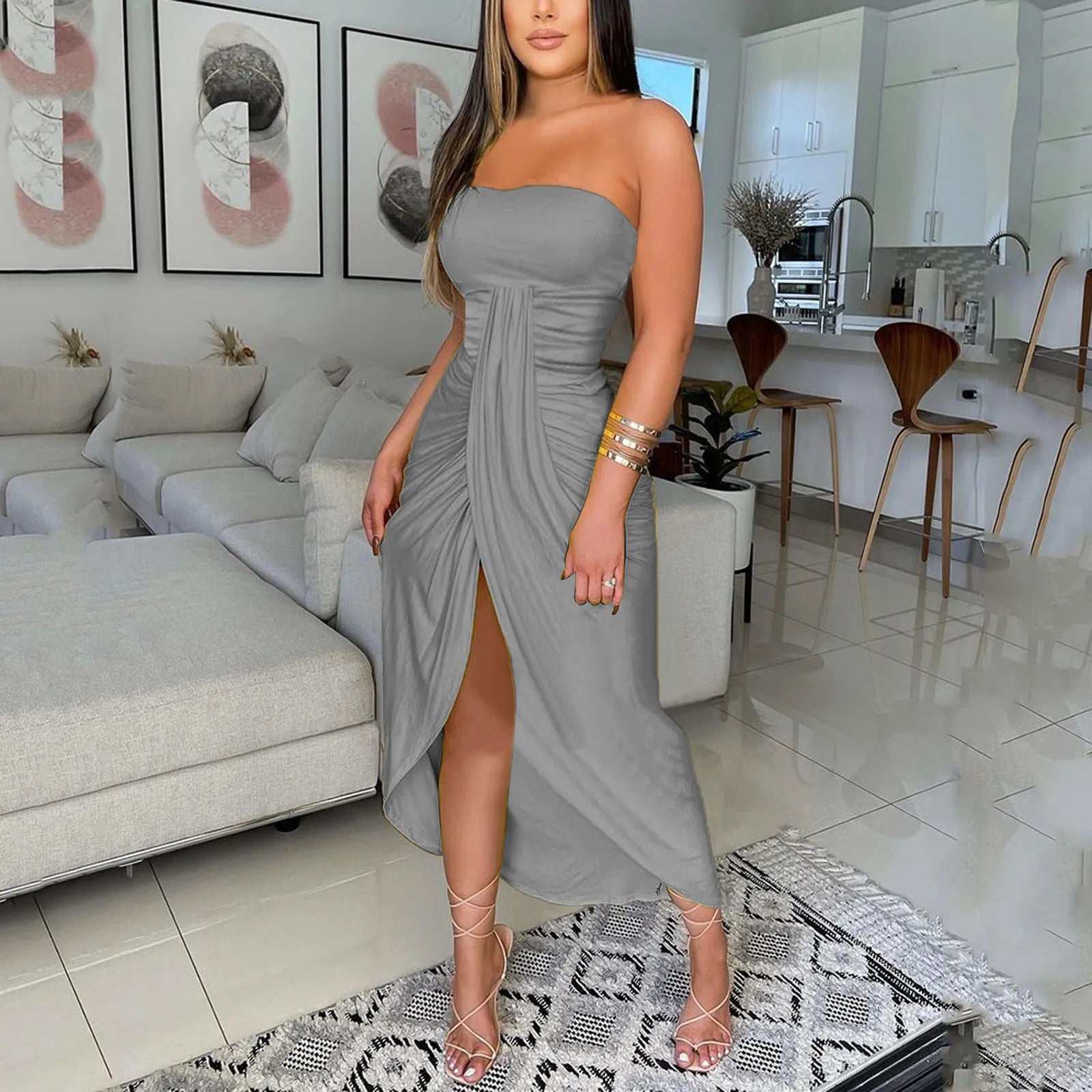 Women's sexy bodycon strapless shoulder dress in a living room setting, highlighting elegant design and fit for summer parties and evenings.