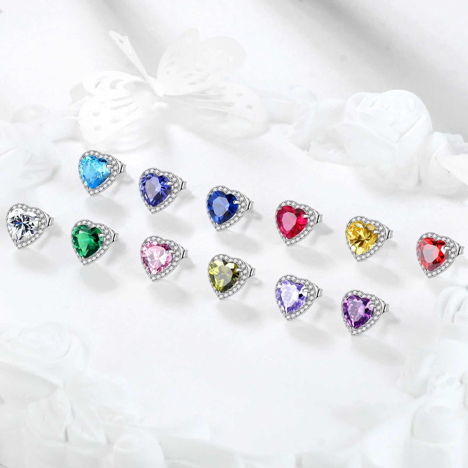 Heart-shaped colorful birthstone jewelry set with multiple vibrant gemstones displayed on a white background.