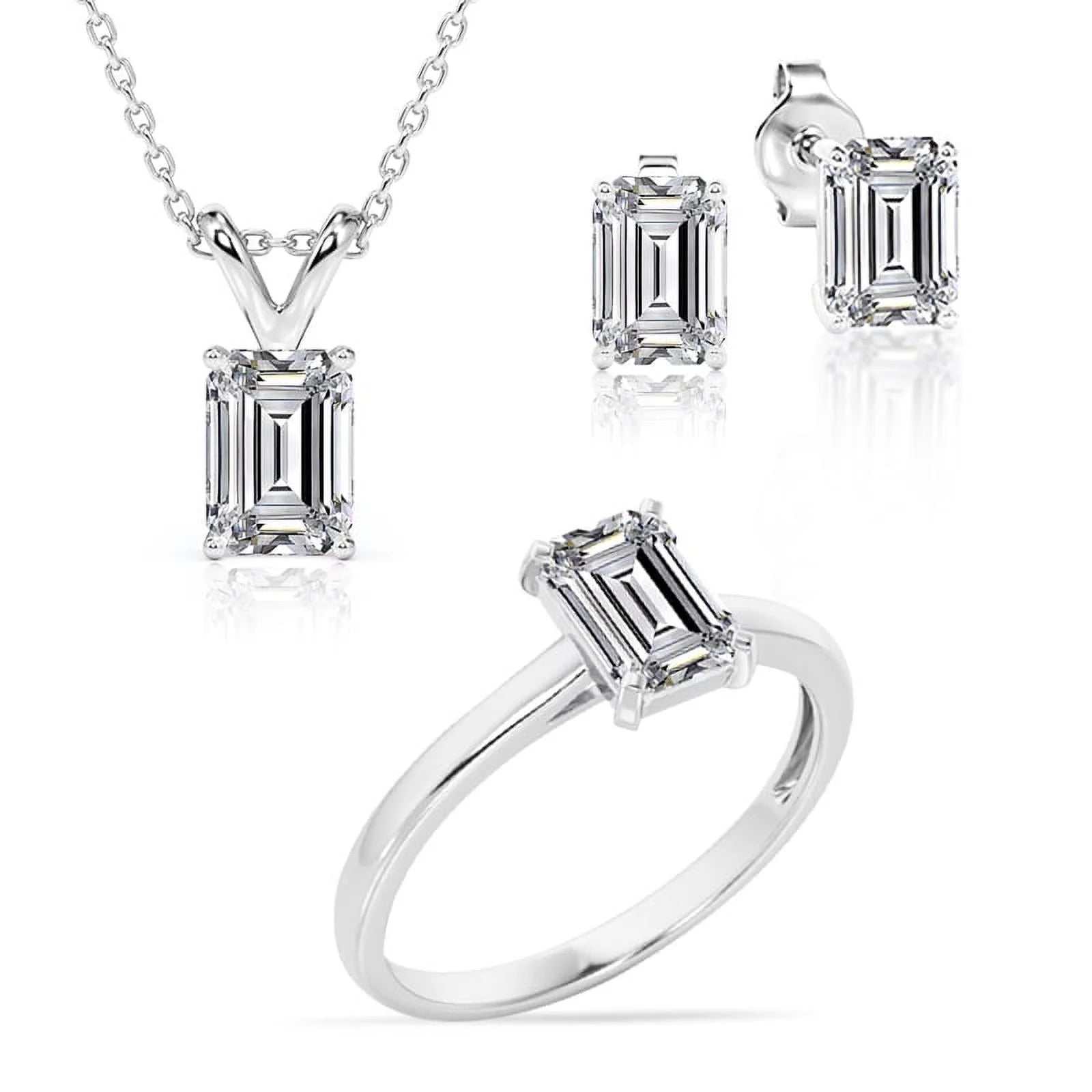 Ring Earrings and Pendant Set of ring, earrings, and pendant with 3 carat emerald-cut moissanites in 18K white gold.