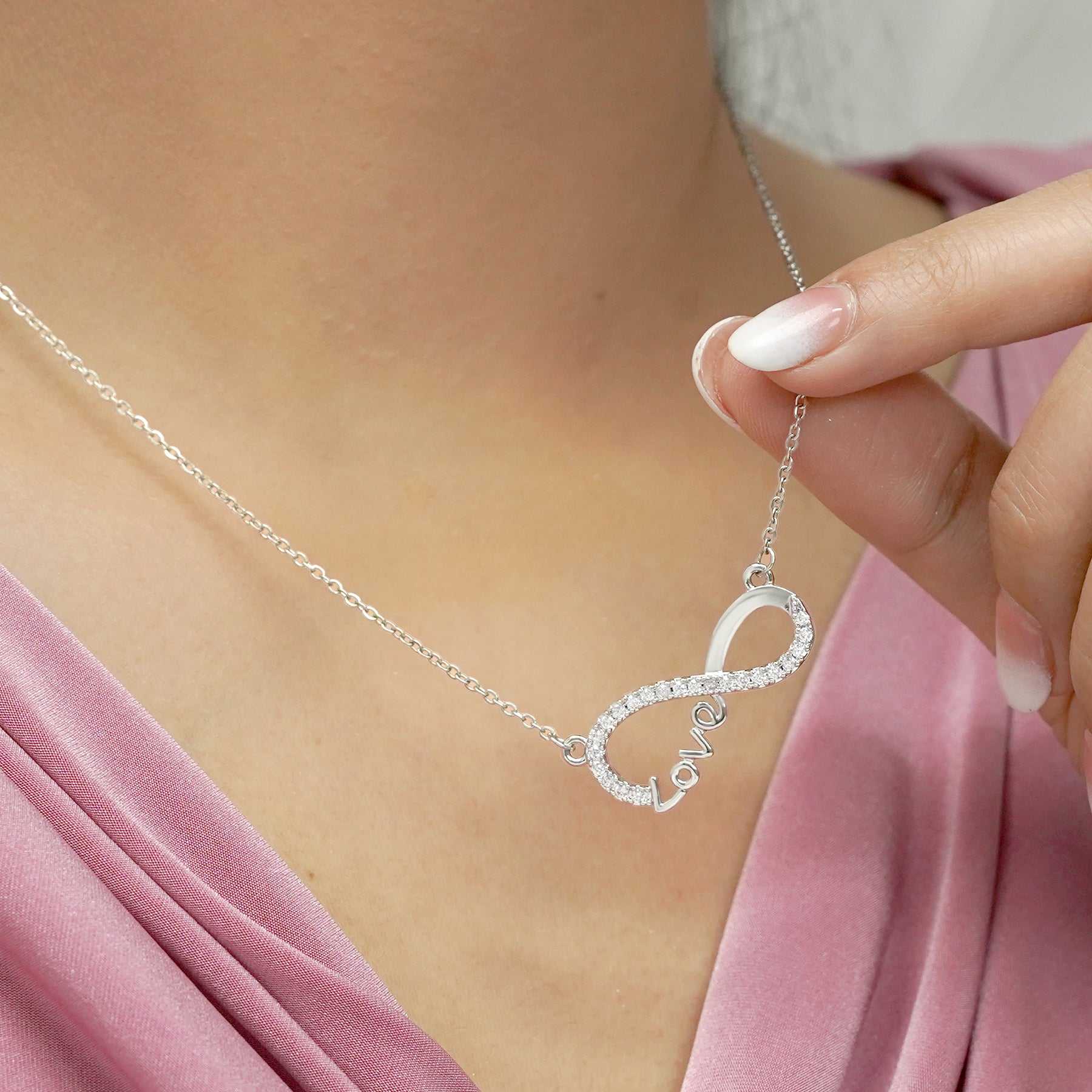 Infinity love pendant necklace in 18K yellow gold plated, featuring delicate cubic zirconia stone, perfect for anniversary gifts.