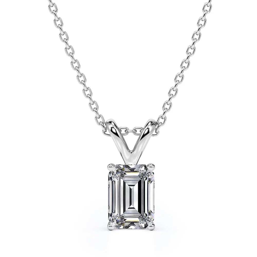 Ring Earrings and Pendant Emerald cut moissanite pendant necklace in white gold.