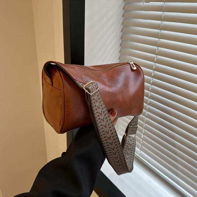 Vintage leather Boston women's small crossbody bag with adjustable strap and classic design, perfect accessory for stylish women.