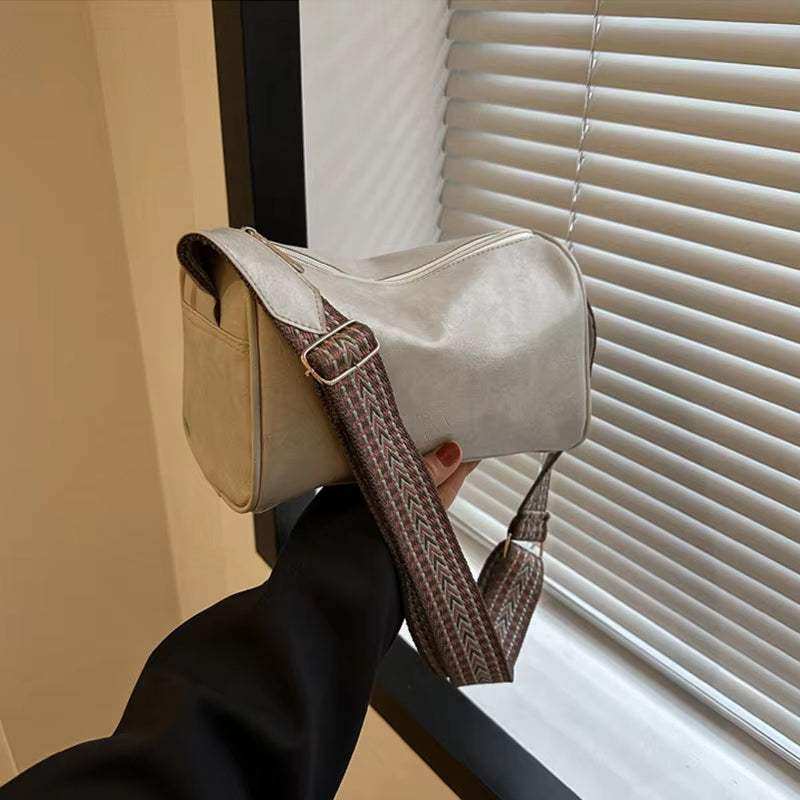 Vintage leather Boston women's small crossbody bag with adjustable strap and classic design.