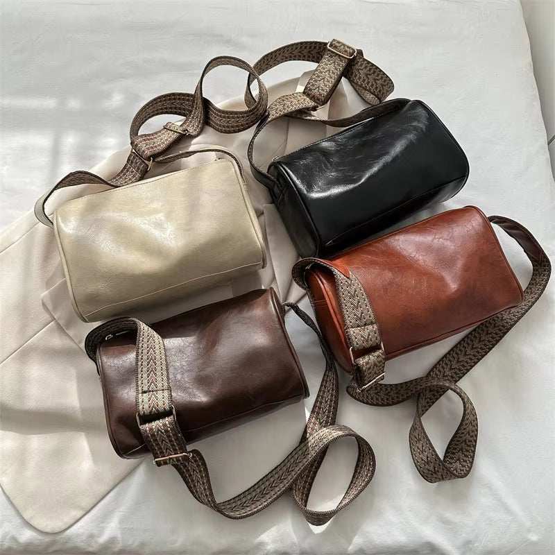 Vintage leather Boston crossbody bags in multiple colors displayed on a white background.
