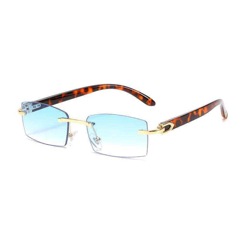 Sunglasses Rimless Rimless horn sunglasses with trendy etched design and blue lenses.